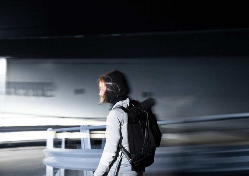 person wearing a black backpack